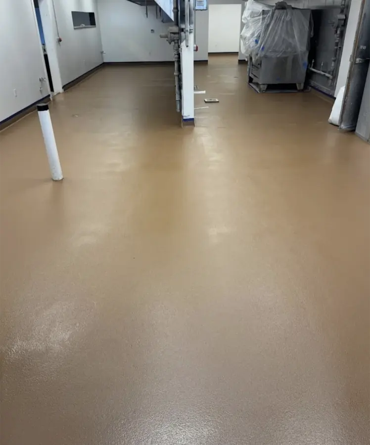 A tan urethane cement floor in a plant room